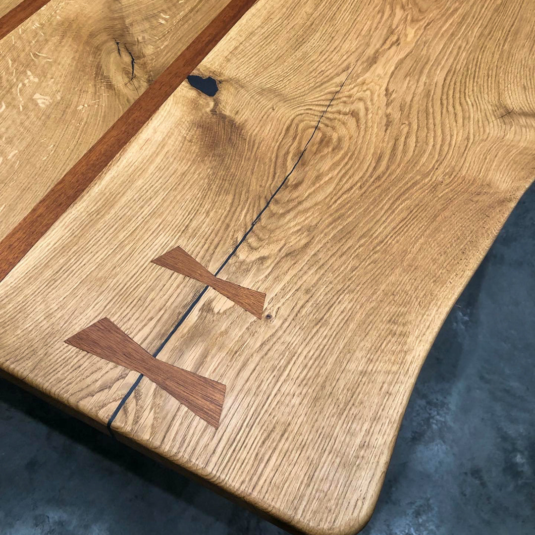 Close up shot showing the detail of a handcrafted oak dining table with live edge by The BOX Furniture