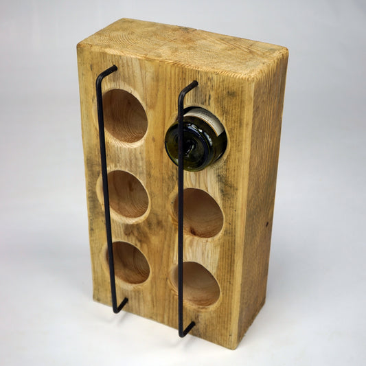 Custom-made pine wine bottle holder by The BOX Furniture, styled in a minimalist studio scene.