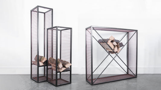 Rustic Industrial Log Towers and Log Cube in a studio setting with firewood inside them.