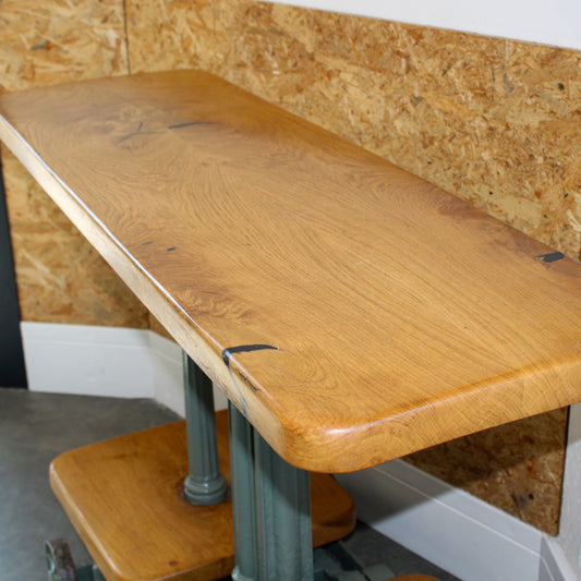 Side view of console table repurposed from vintage Avery industrial weighing scales with lacquered oak shelves and cast iron base.
